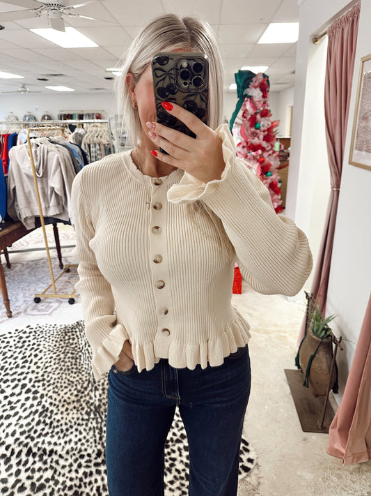 RUFFLE HEM SWEATER